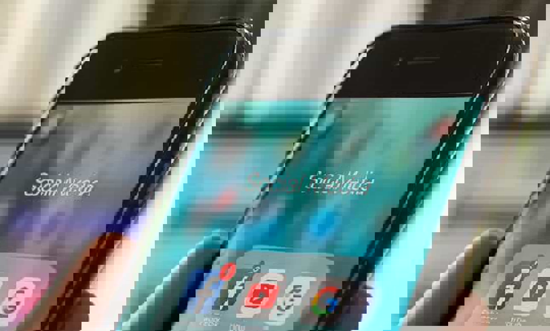 Close up on an iPhone with social media icons