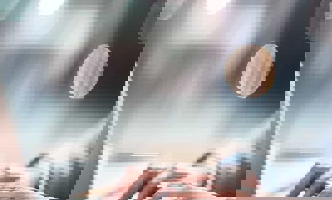 image of woman typing on laptop