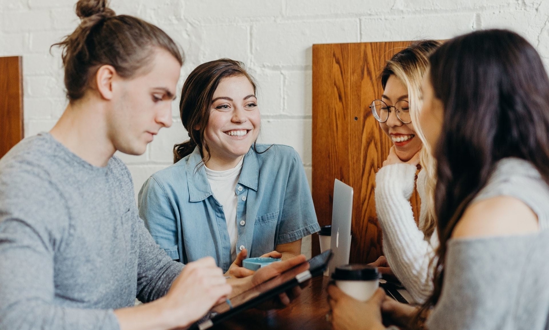 Group of people sitting at at table