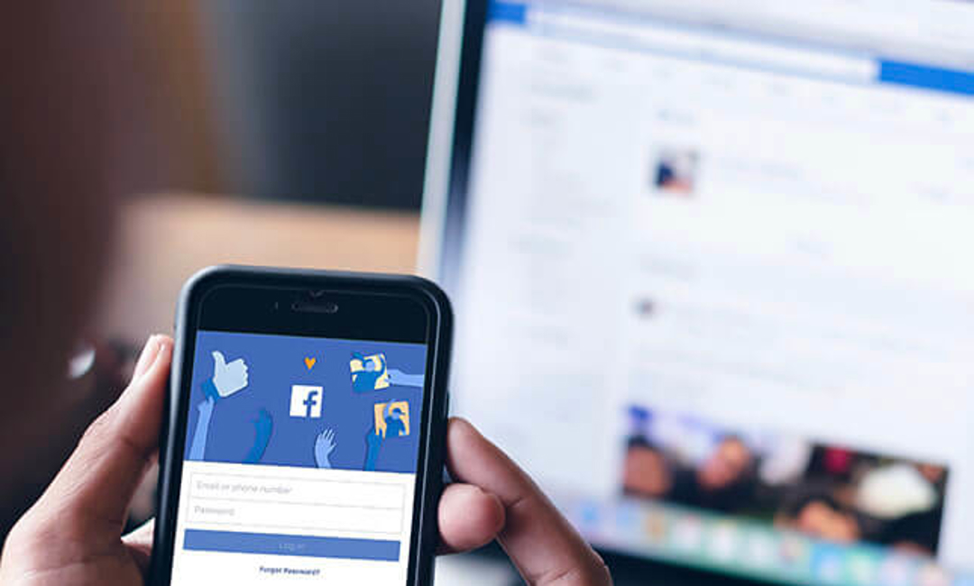 image of person holding mobile phone