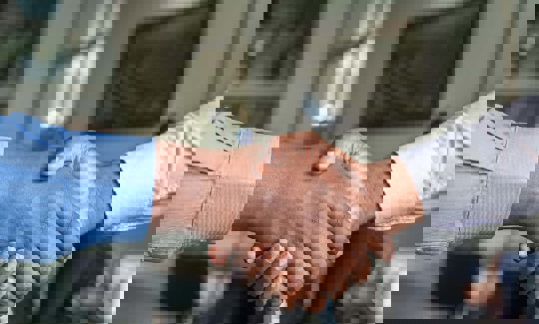 Handshake after agreeing to home services sold by a technician