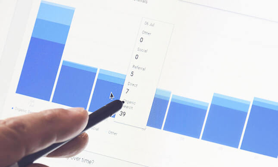 hand pointing to bar graphs