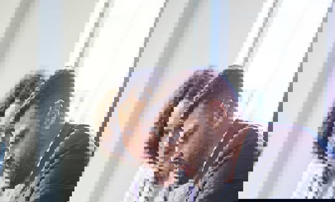 man and woman looking at laptop