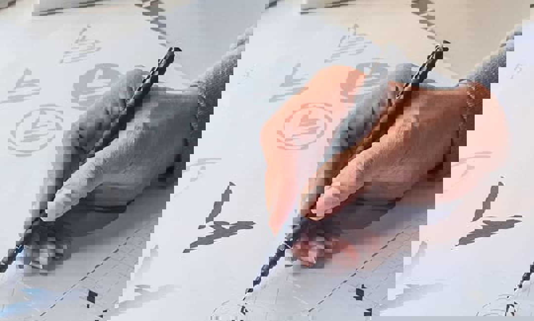 man hand drawing logo developing a brand