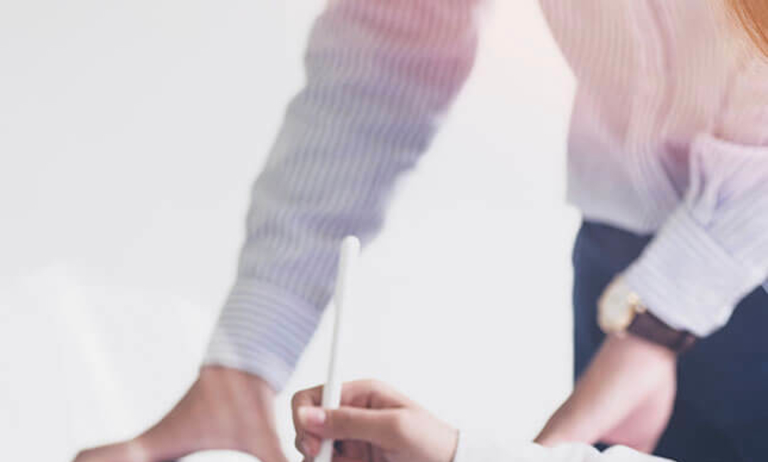 close up of hands working on documents