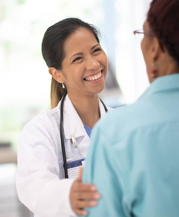 A doctor greeting a patient