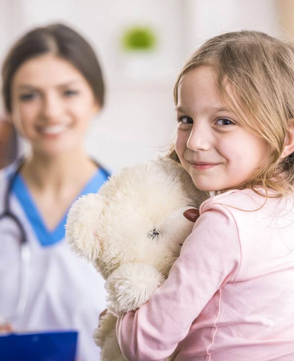 A child with her stuffed animal.