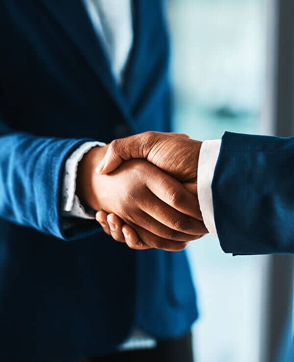 Two hands shaking indicating partnership