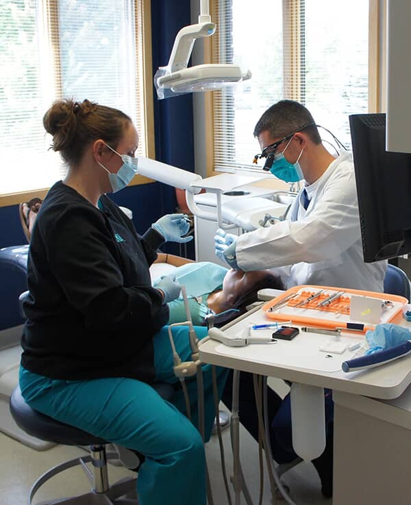 Dr Eastman working on patient