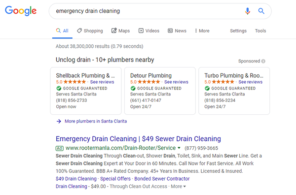 A Google search for "emergency drain cleaning" shows three Local Services Ads for plumbers above a pay-per-click ad.