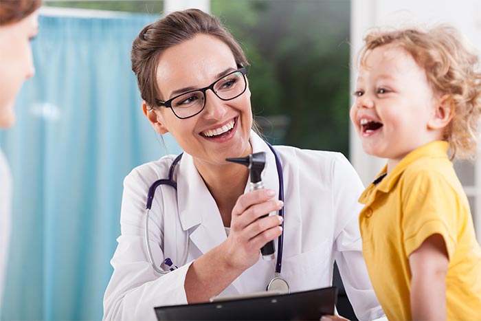 image of doctor working with little boy 
